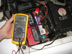 checking battery voltage with a voltmeter